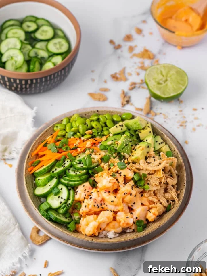 Spicy Shrimp Poke Bowl Recipe with Fresh Mango & Avocado 11 fully assembled shrimp poke bowl with veggies and avocado