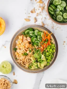 shrimp poke bowl with avocado, edamame, carrot and cucumbers
