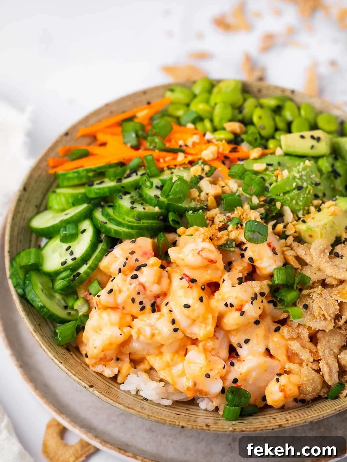 Spicy Shrimp Poke Bowl Recipe with Fresh Mango & Avocado 3 close up view of chopped shrimp tossed with a creamy sweet chili sauce