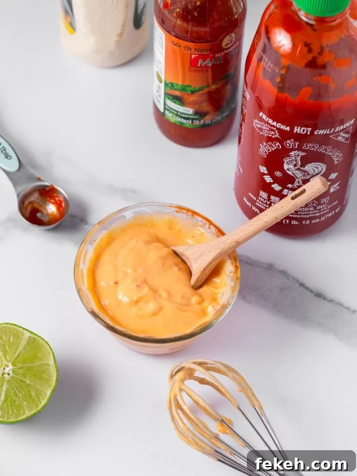 Spicy Shrimp Poke Bowl Recipe with Fresh Mango & Avocado 6 whisked sweet chili sriracha sauce