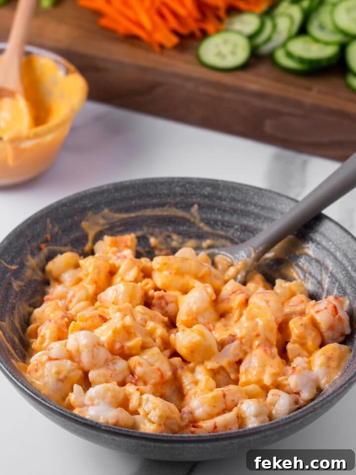 Spicy Shrimp Poke Bowl Recipe with Fresh Mango & Avocado 8 shrimp pieces coated in creamy sriracha sauce