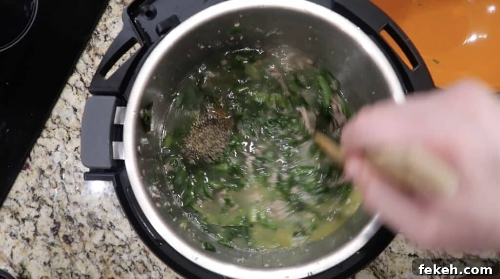 Instant Pot Escarole and White Bean Soup Recipe 16 Stirring Pot.