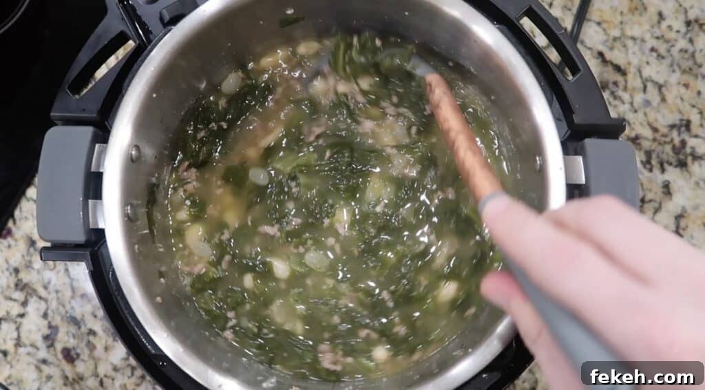 Instant Pot Escarole and White Bean Soup Recipe 19 Stirring pot
