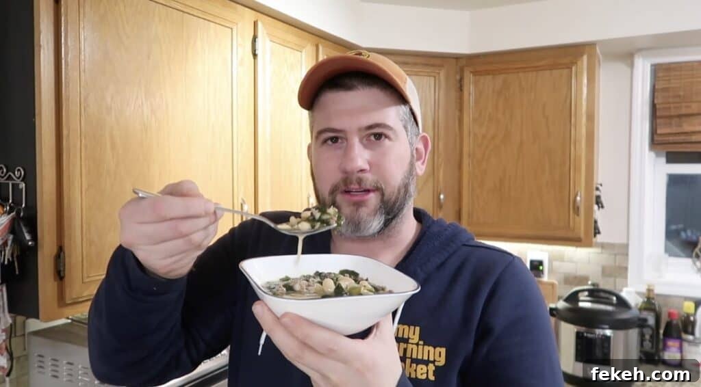 Instant Pot Escarole and White Bean Soup Recipe 24 Man with soup