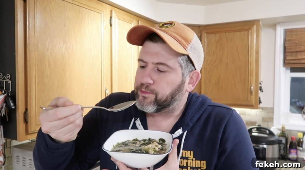 Instant Pot Escarole and White Bean Soup Recipe 26 Man staring at spoon
