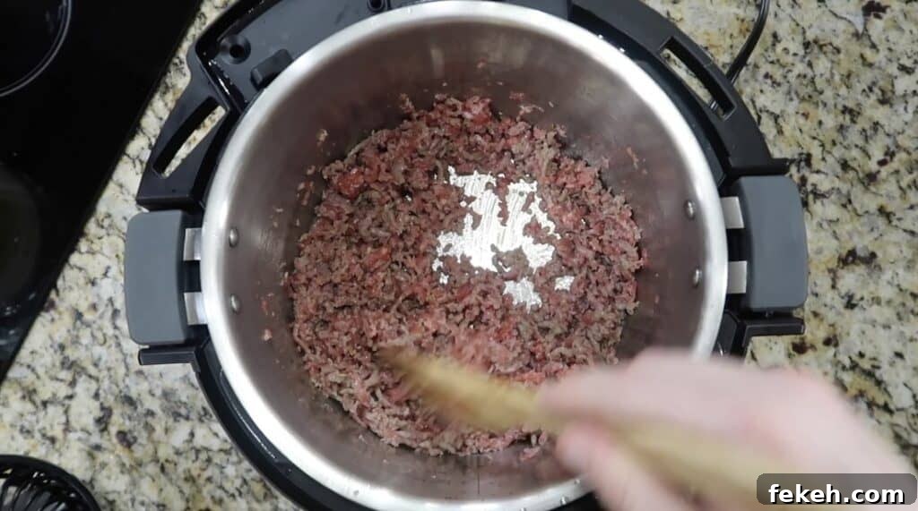 Instant Pot Escarole and White Bean Soup Recipe 7 Sautéing sausage