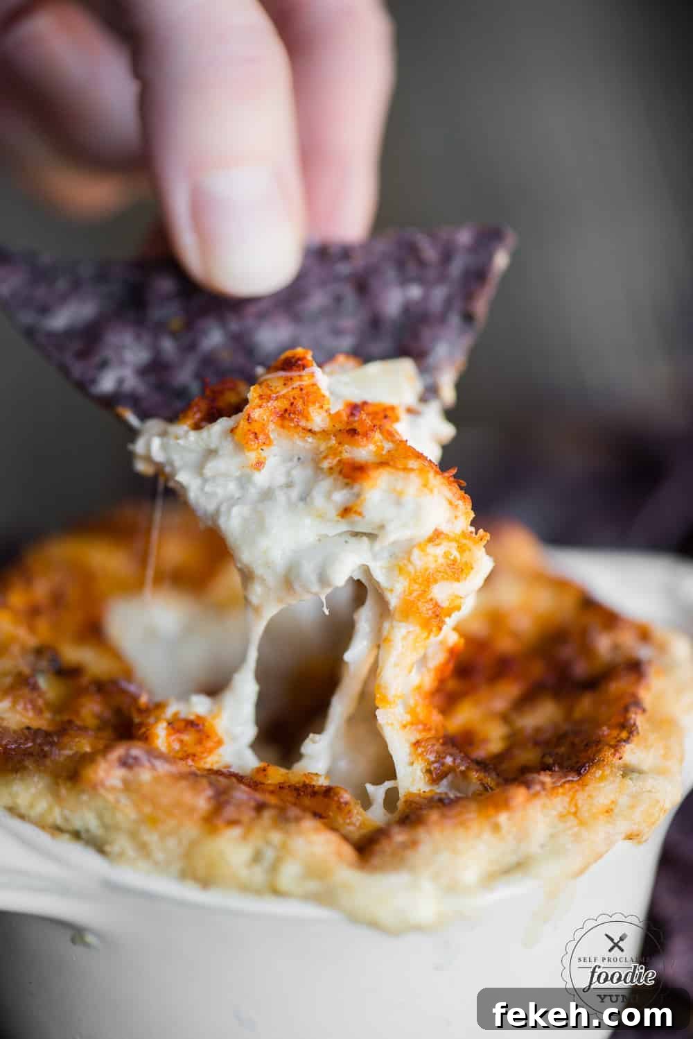 Hot Crab Dip is a crowd pleasing baked appetizer full of real crab, marinated artichokes, and rich and decadent cheeses. You won't find a better crab dip recipe if you're looking for something that is easy to make, is hot and bubbly, and will be the talk of the town. crab artichoke dip