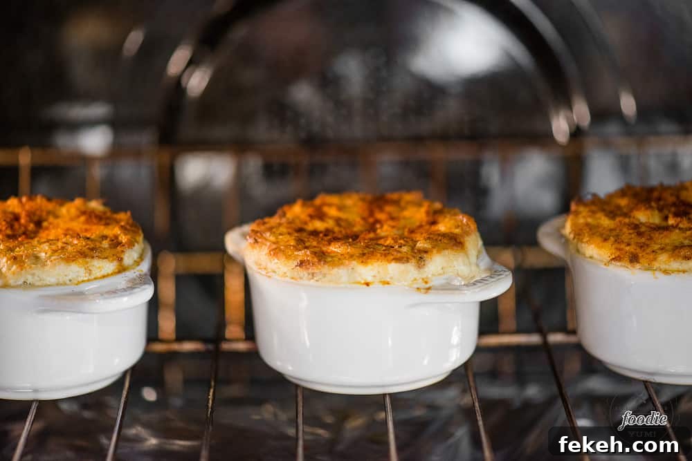 Hot Crab Dip is a crowd pleasing baked appetizer full of real crab, marinated artichokes, and rich and decadent cheeses. how to make hot crab dip