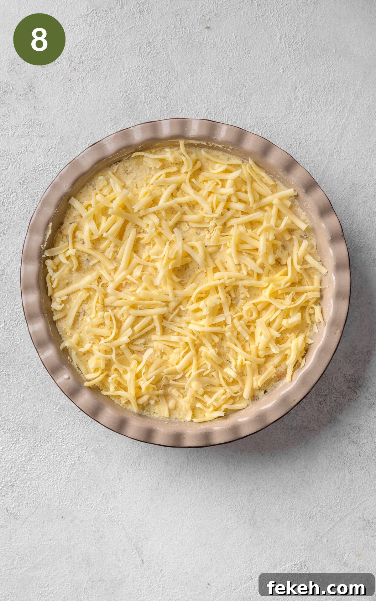 Cheesy Potato Pie Recipe: Crispy Crust & Melty Filling 11 cheese and potato pie in a baking dish.