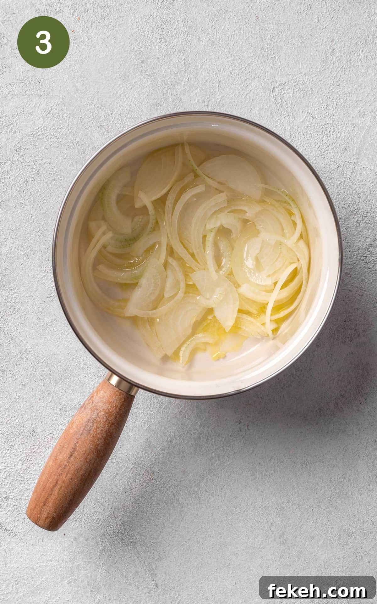 Cheesy Potato Pie Recipe: Crispy Crust & Melty Filling 6 cooking onions in a saucepot.