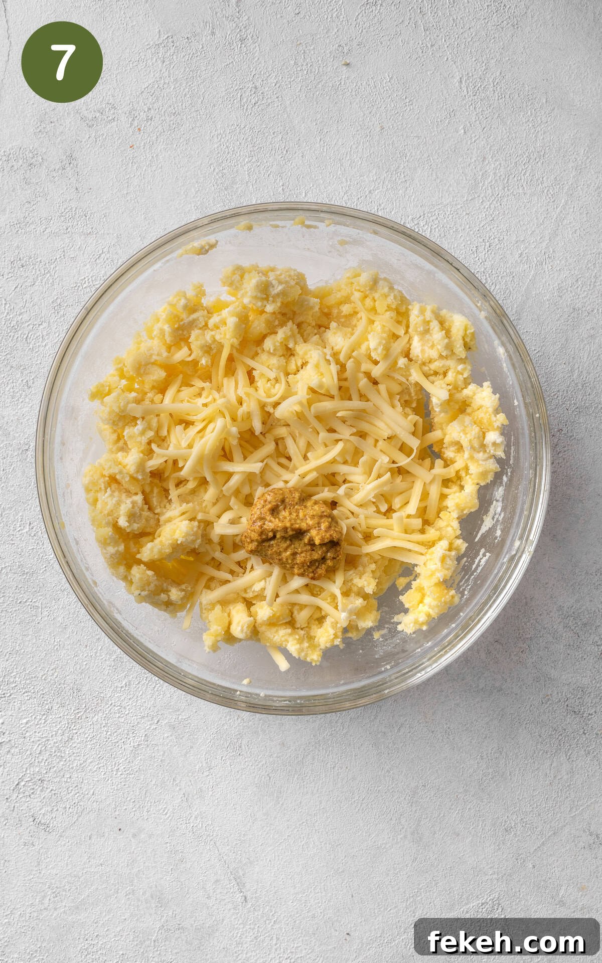 Cheesy Potato Pie Recipe: Crispy Crust & Melty Filling 10 mixing caramelised onions with cheese, potatoes and butter.