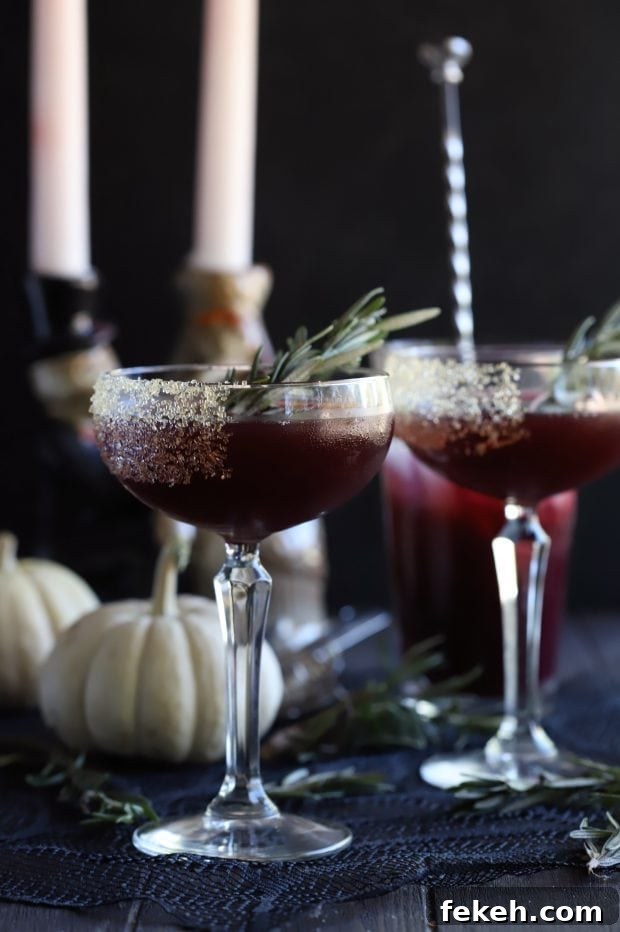 Pomegranate Mezcal Cocktail Recipe for Halloween Parties 2 Spooky Pomegranate Mezcal Cocktail from the side with candlesticks