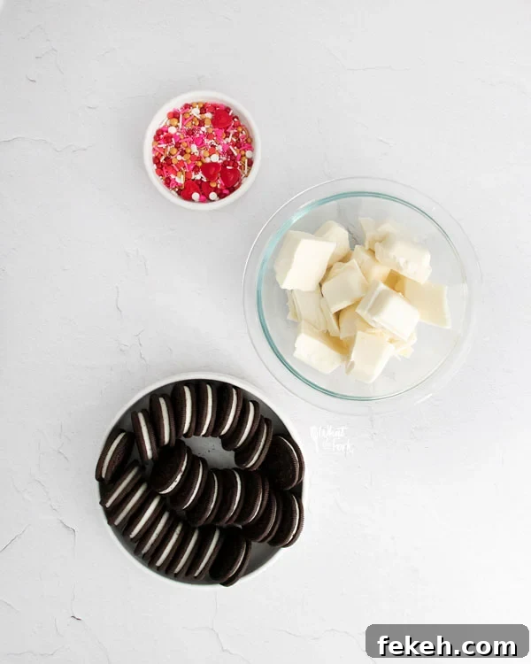 overhead shot of ingredients for Valentine's Chocolate Covered Oreos in separate bowls