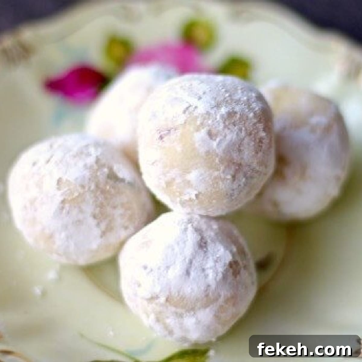 Creamy White Chocolate Truffles Made with Condensed Milk 2 White chocolate truffles on a dessert plate.