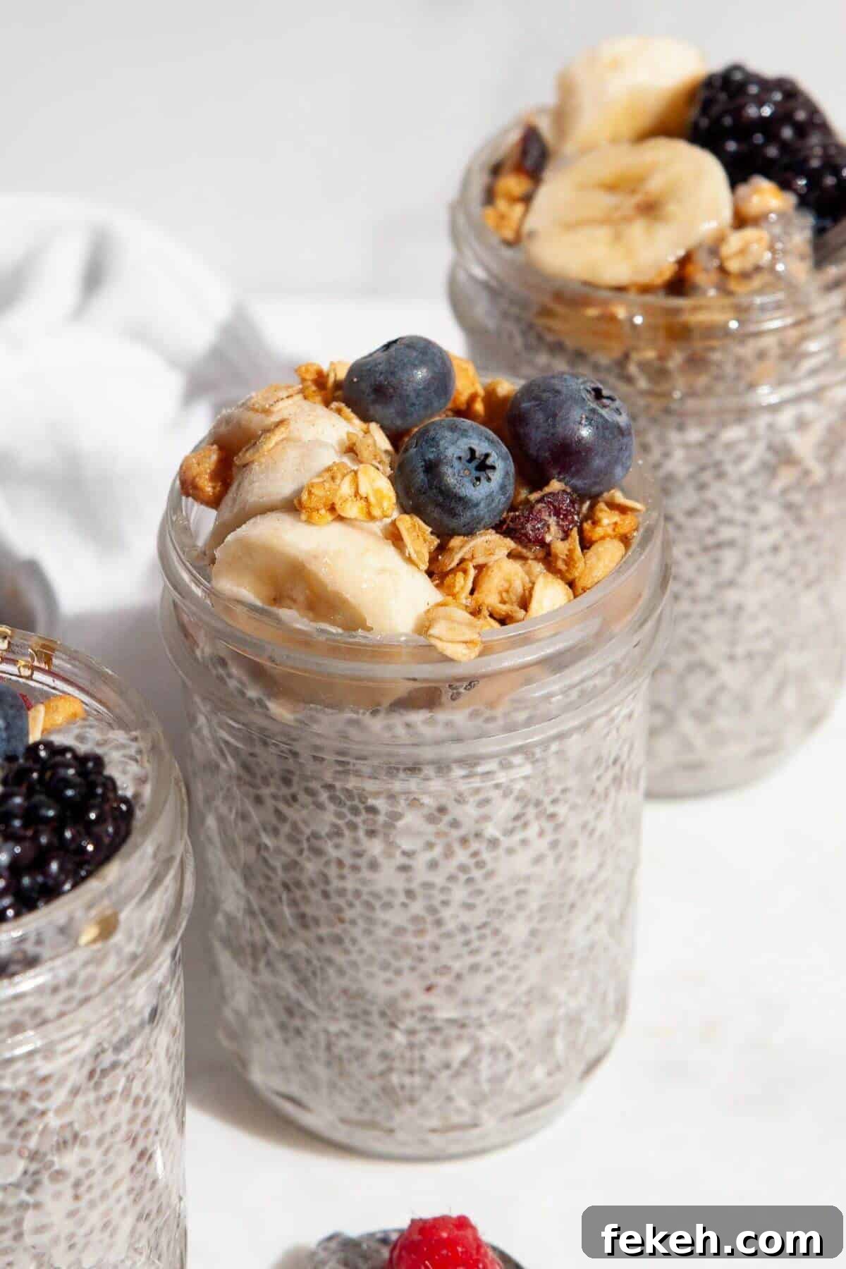 Creamy Banana Chia Pudding with Vanilla and Maple 2 Banana chia seed pudding in mason jar with blueberries and granola.