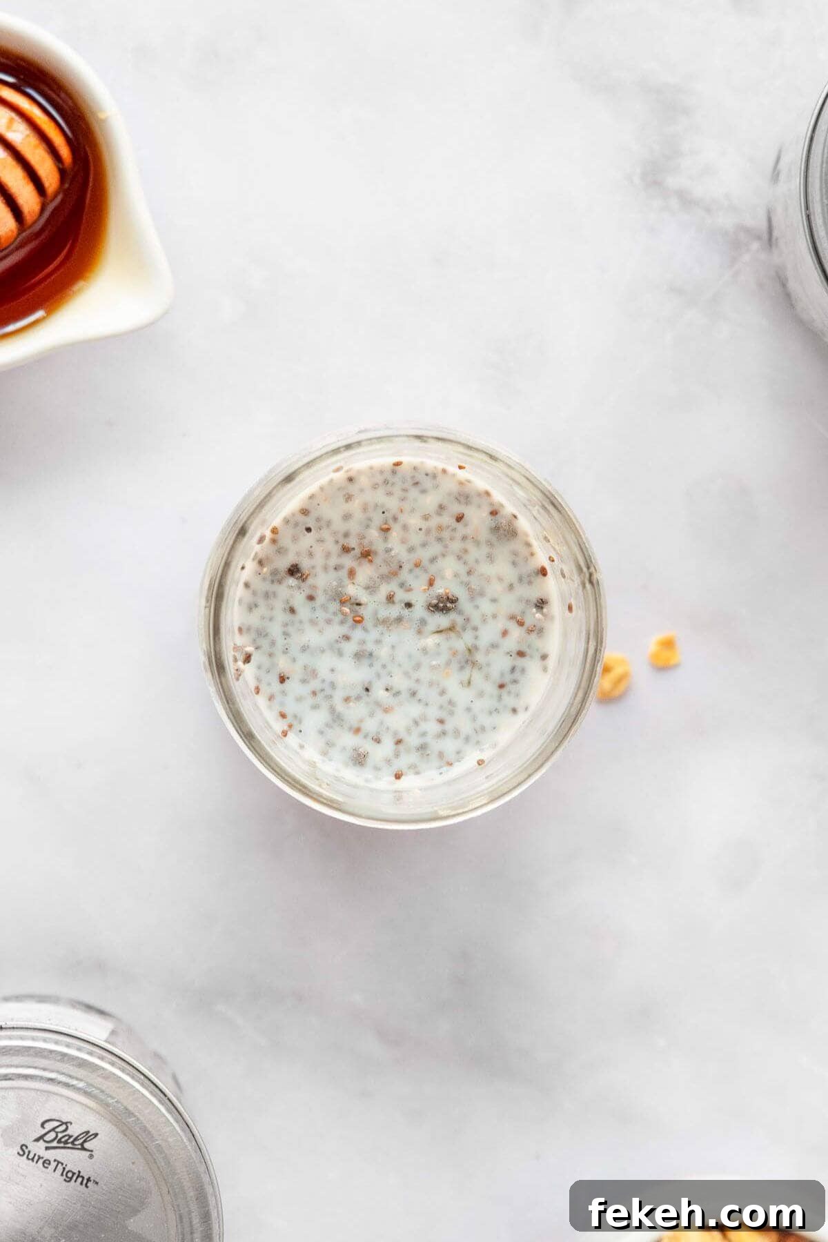 Creamy Banana Chia Pudding with Vanilla and Maple 4 Adding all ingredients in banana chia seed pudding into a mason jar to soak overnight.