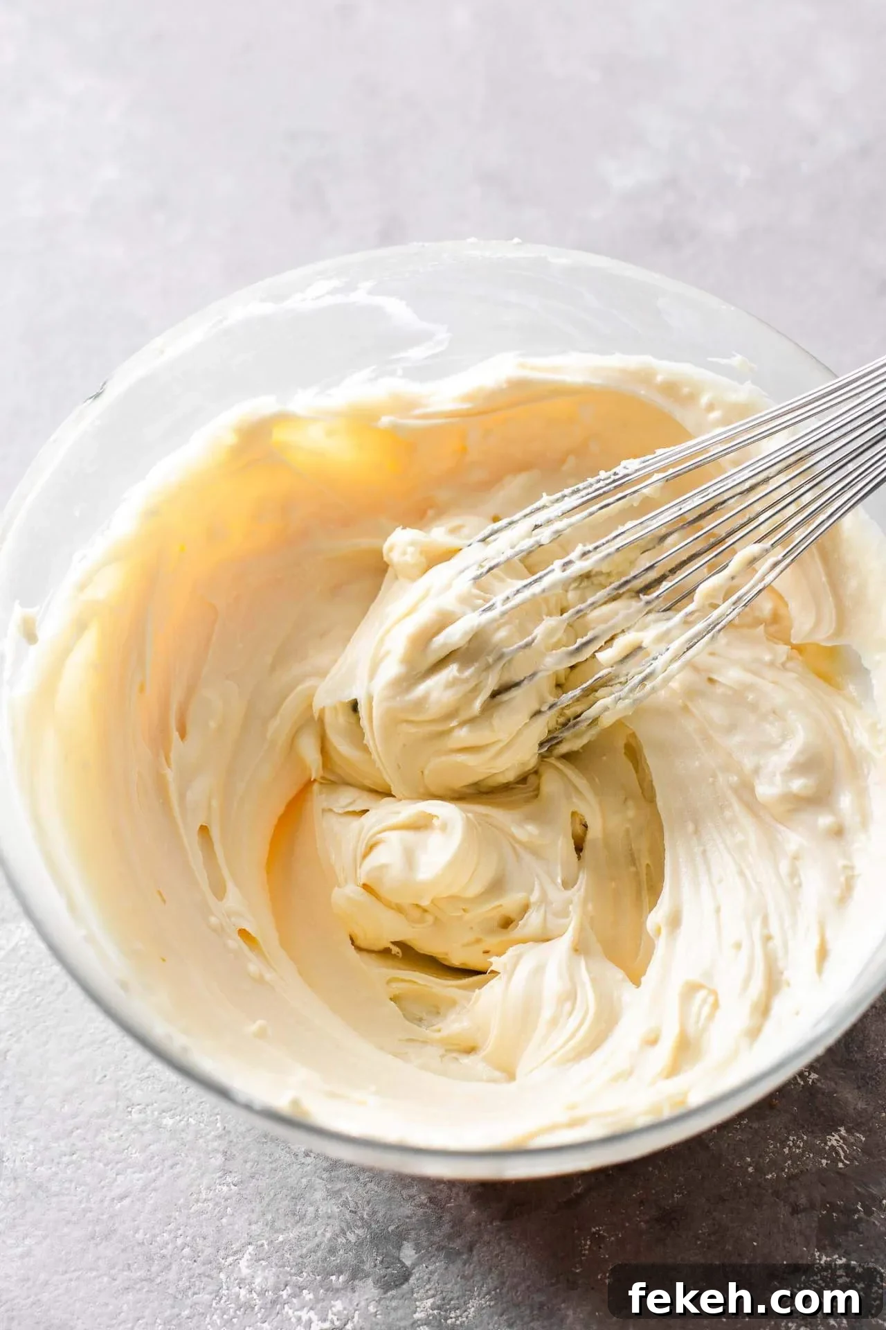 small batch cheesecake cream cheese and sugar creamed together in bowl