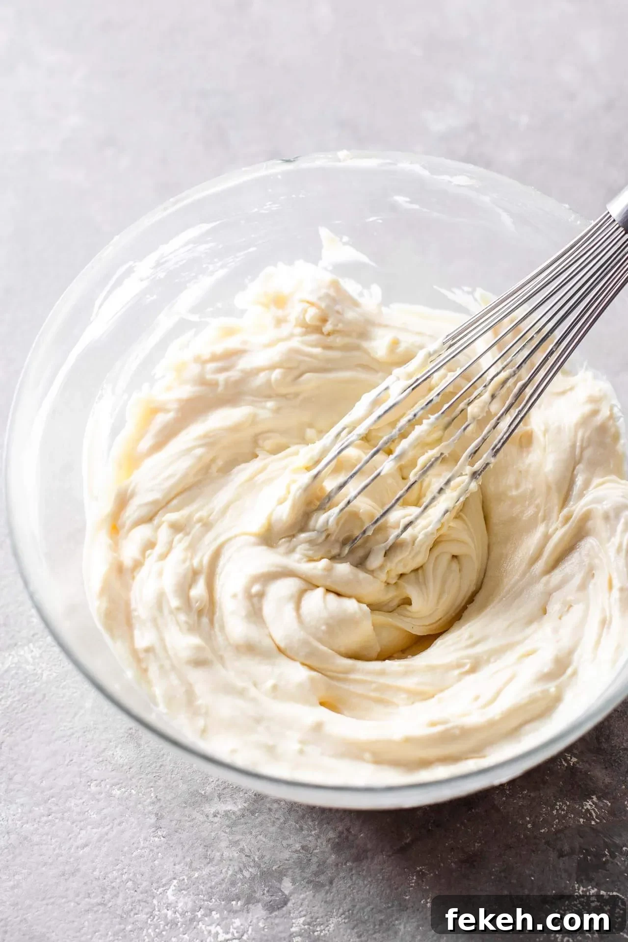 small batch cheesecake filling ingredients mixed together in bowl minus the eggs
