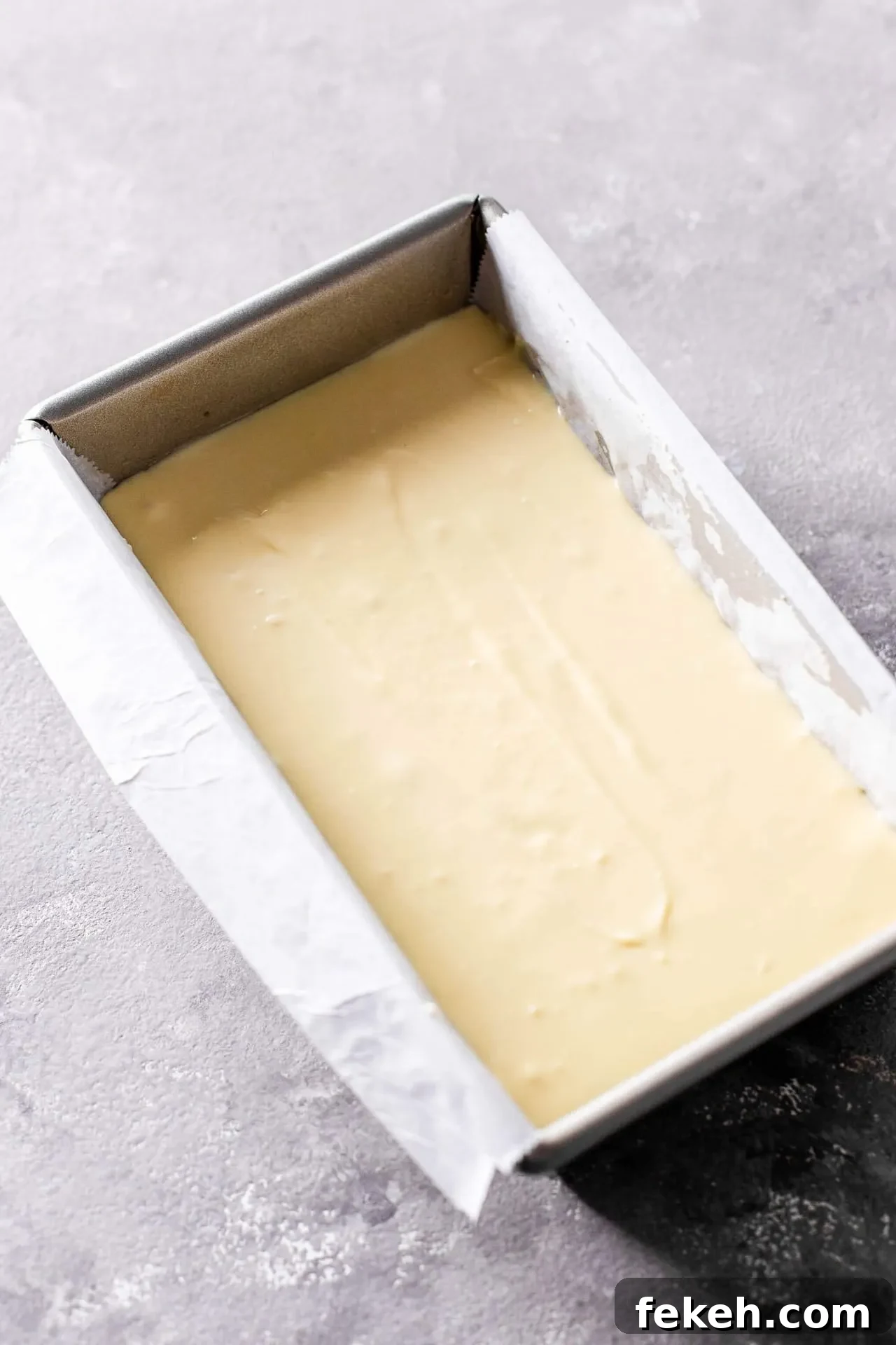 small batch cheesecake filling poured into pan