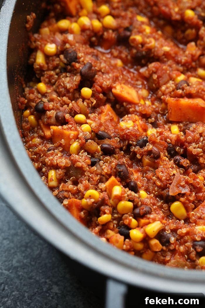 Whip up this savory Slow Cooker Mexican Quinoa for a pantry-staple meal that's also naturally vegan and gluten-free! Fully cooked Mexican quinoa in the slow cooker
