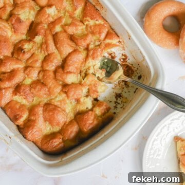 donut bread pudding in a casserole dish, with plate with a serving and donuts next to it.