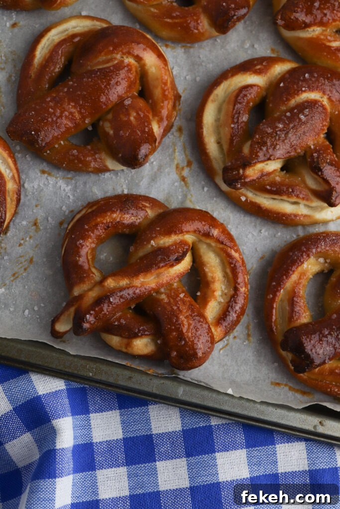 Shaping pizza dough into pretzels