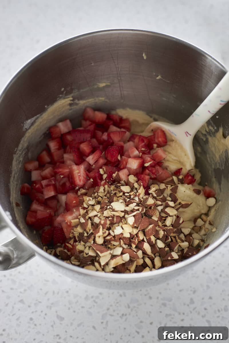 Strawberry Almond Muffins Recipe with Crispy Streusel Topping 9 Strawberries and chopped almonds added to the batter.