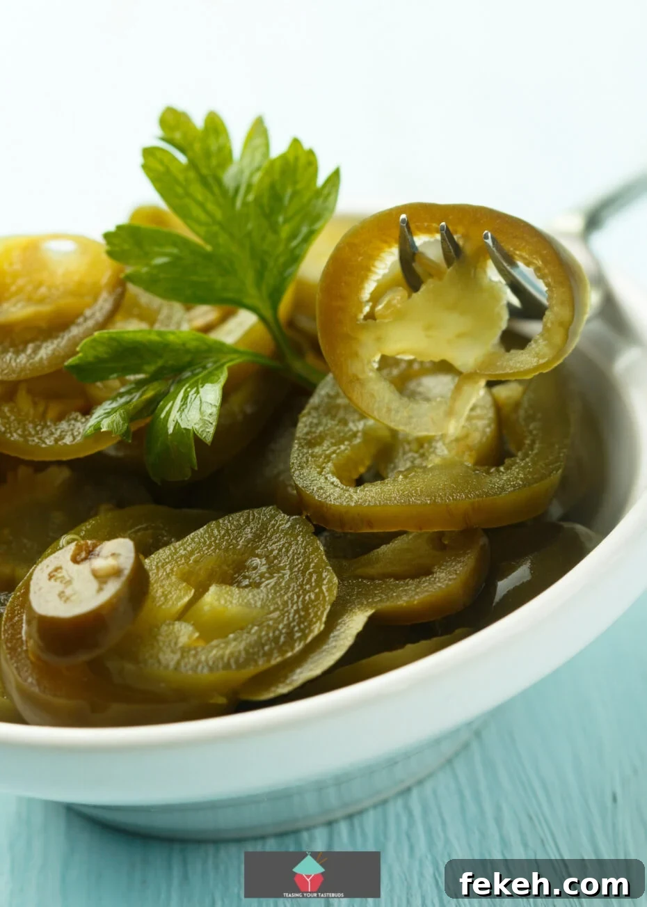 Tangy Pickled Pepper Rings Recipe for Zesty Snacks and Toppings 3 Pickled Pepper Rings - sliced pepper rings in jars