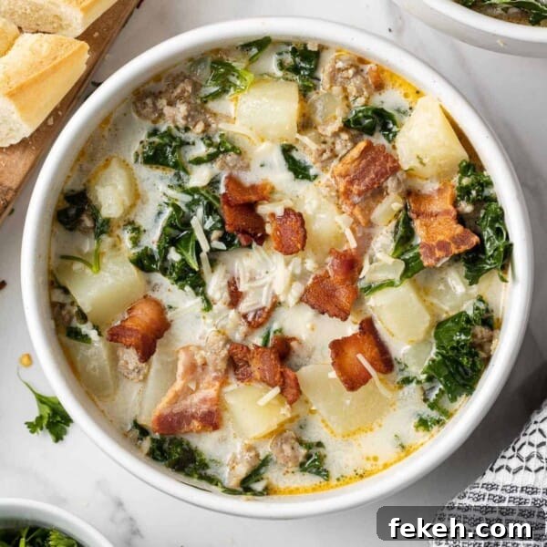 Instant Pot Black Bean Soup with Soaked or Dry Beans 13 Overhead view of zuppa toscana soup in a white bowl garnished with crispy bacon.