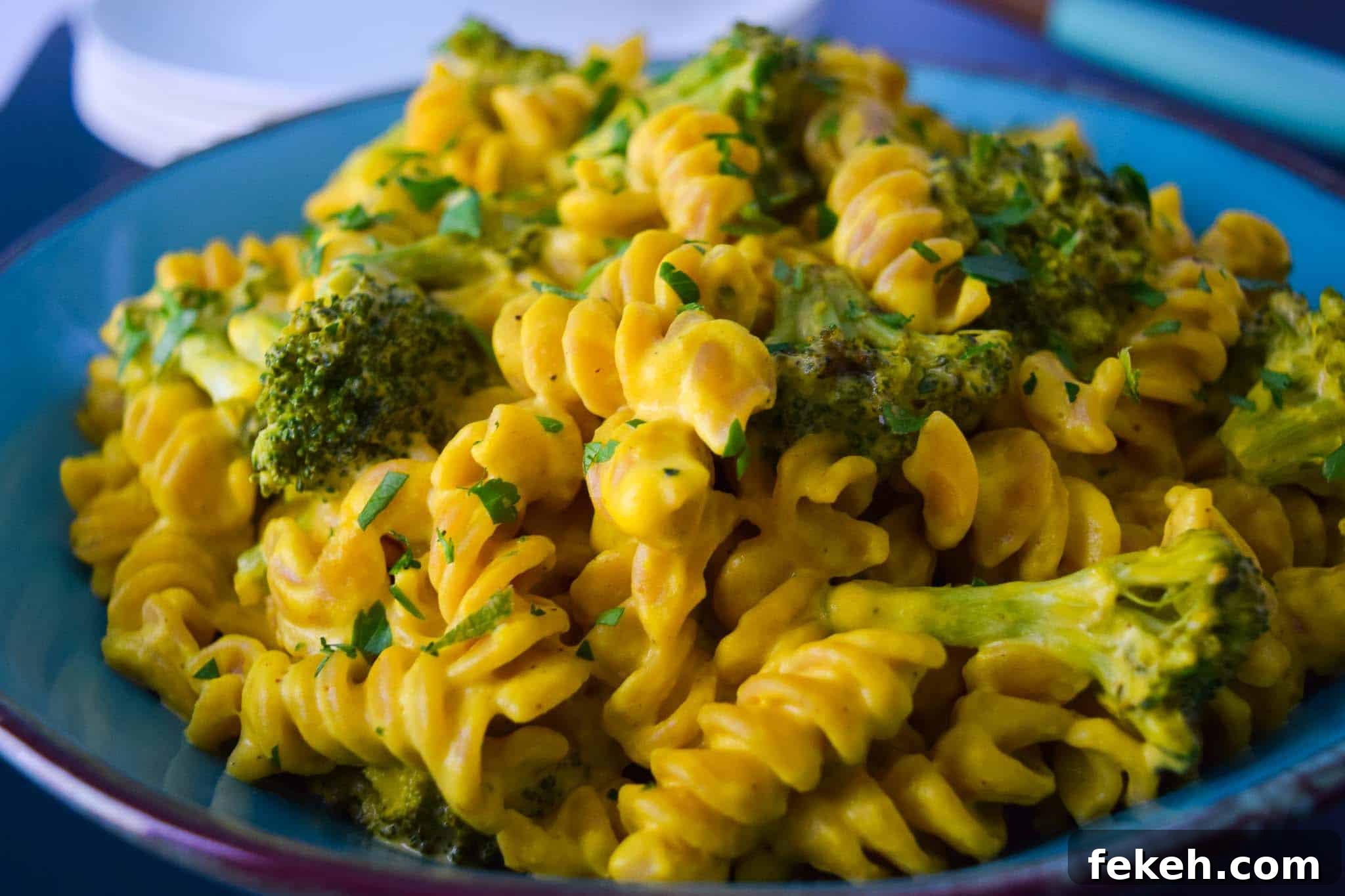 Roasted Broccoli Rotini with a Surprising Secret Ingredient 3 Secret Ingredient Roasted Broccoli Rotini on blue plate close up