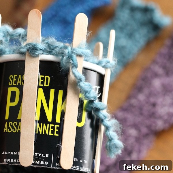 Loom-Knit Fingerless Gloves Tutorial for Homemade Knitting Loom 6 homemade loom with cardboard cannister and popsicle sticks