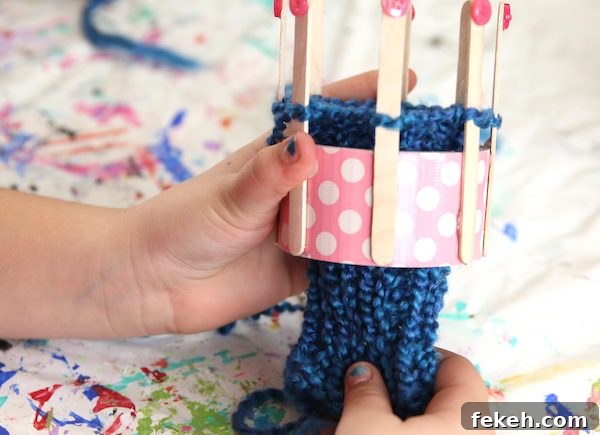 Loom-Knit Fingerless Gloves Tutorial for Homemade Knitting Loom 7 blue glove on duct tape loom