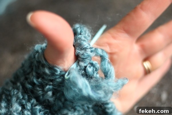 Loom-Knit Fingerless Gloves Tutorial for Homemade Knitting Loom 9 stitching thumb hole in fingerless glove