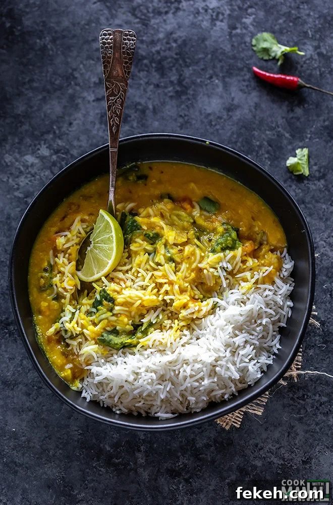 rice and dal in a bowl with a lemon wedge 