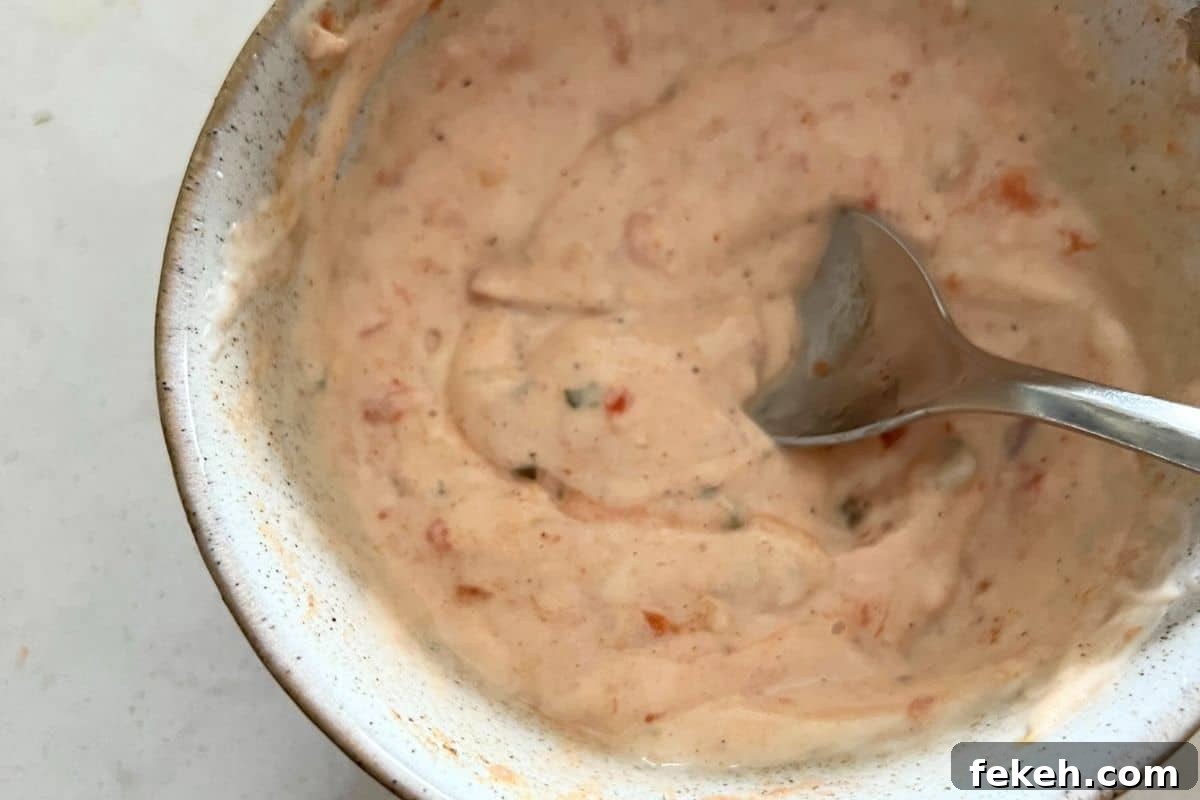 Applebee's Chicken Fajita Roll-Up Copycat Recipe 4 Sauce ingredients combined in a bowl.
