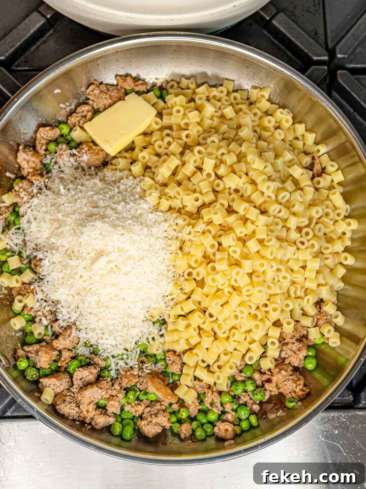 Ditalini Pasta with Italian Sausage and Peas 7 Cooked ditalini pasta, grated Parmesan cheese, and a pat of butter added to the skillet with the sausage and peas before tossing.