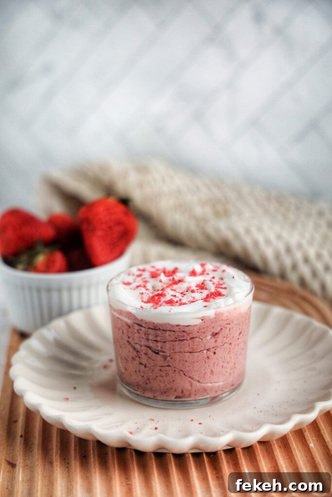 Strawberry Mousse Recipe (Paleo & Vegan) 3 Jar of strawberry mousse topped with coconut whipped topping.