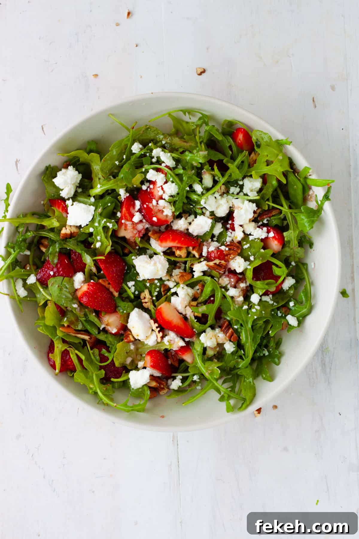 Strawberry Goat Cheese Salad with Balsamic Glaze 7 Strawberry and goat cheese salad in a white mixing bowl.