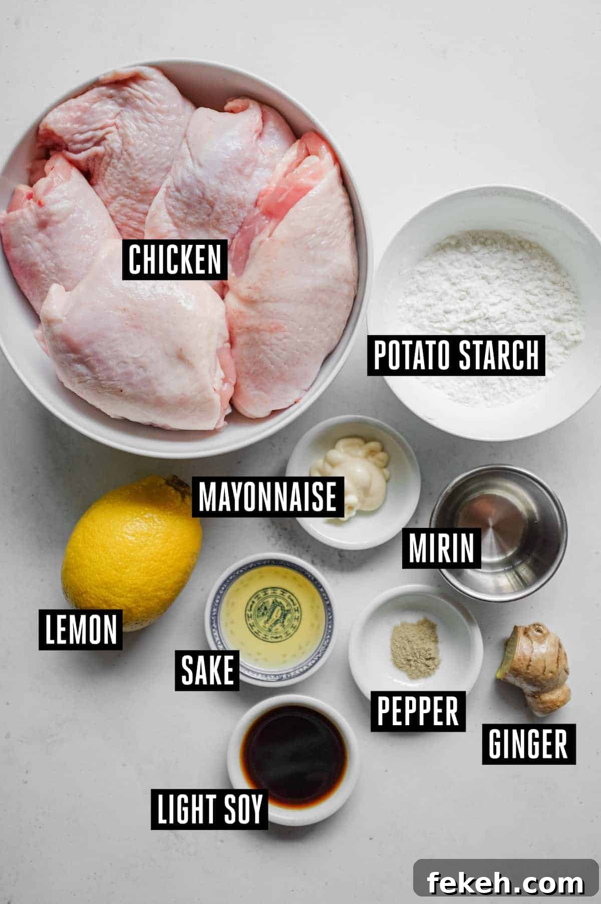 The ingredients for Japanese karaage chicken: chicken, potato starch, lemon, mayonnaise, sake, mirin, soy, and ginger