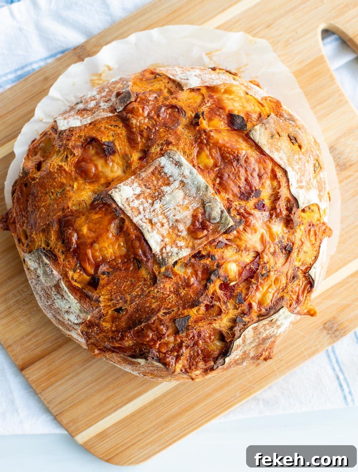 Sourdough Pizza Bread Recipe for Crispy, Flavorful Crust 2 A loaf of pizza sourdough bread on a cutting board.