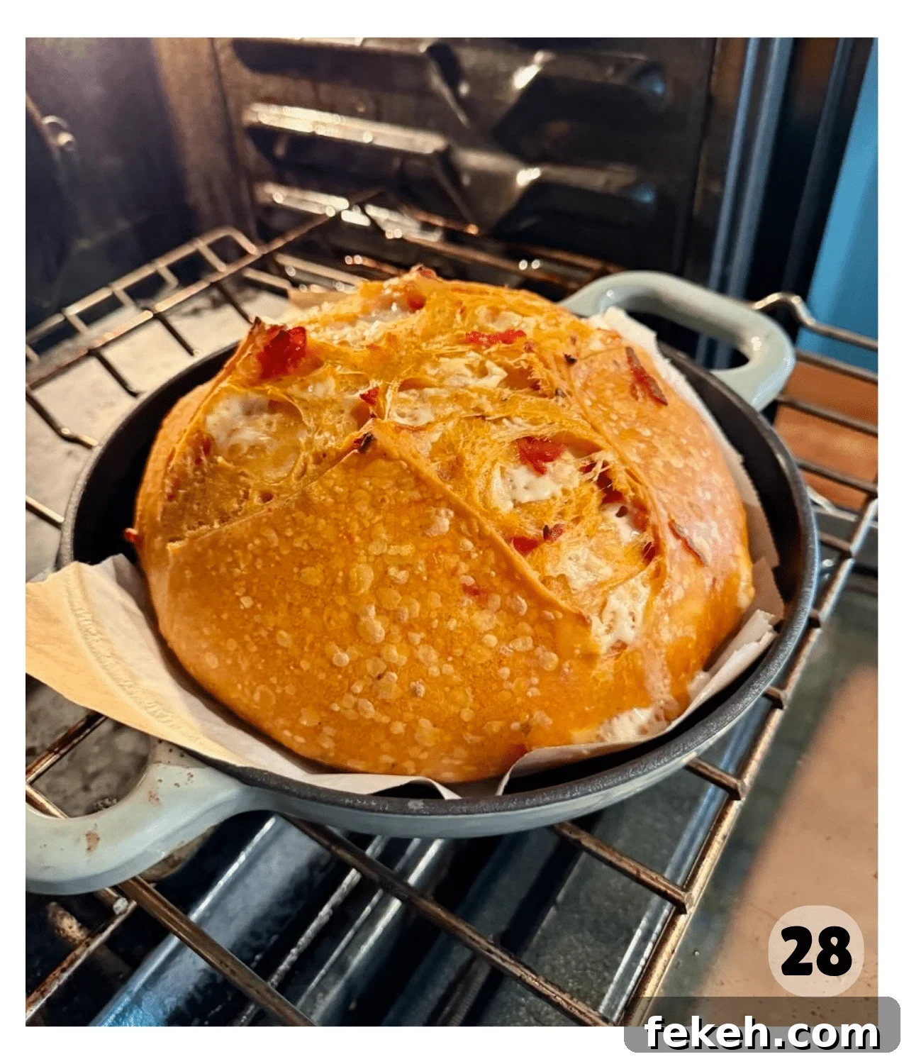 Sourdough Pizza Bread Recipe for Crispy, Flavorful Crust 16 A golden brown loaf of pizza sourdough bread is removed from the oven.
