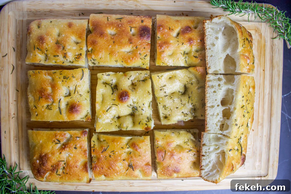 Crispy Sourdough Focaccia Recipe for Flavorful Homemade Bread 3 rosemary sourdough focaccia on cutting board
