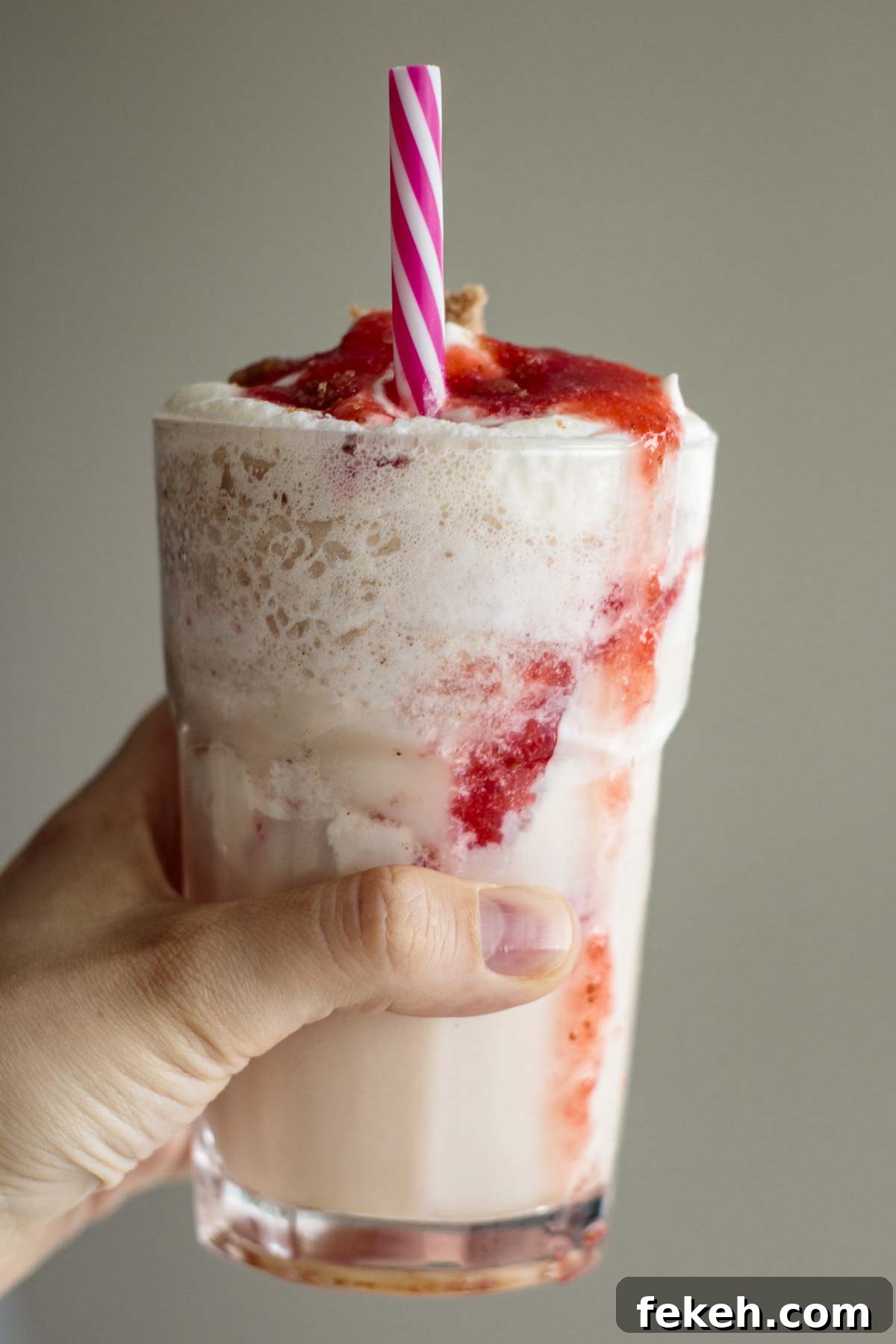 Starbucks Strawberry Funnel Cake Frappuccino Review & Order Guide 8 Hand holding frappuccino.