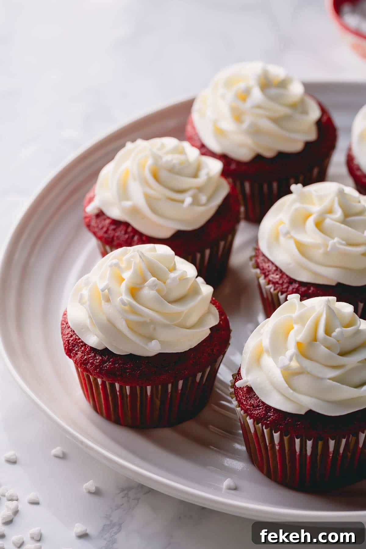 Cream Cheese Frosting Recipe: Smooth, Tangy Icing for Cakes and Cupcakes 7 Half a dozen red velvet cupcakes frosted with cream cheese frosting
