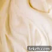 Cream Cheese Frosting Recipe: Smooth, Tangy Icing for Cakes and Cupcakes 9 Upclose creamy smooth cream cheese frosting.