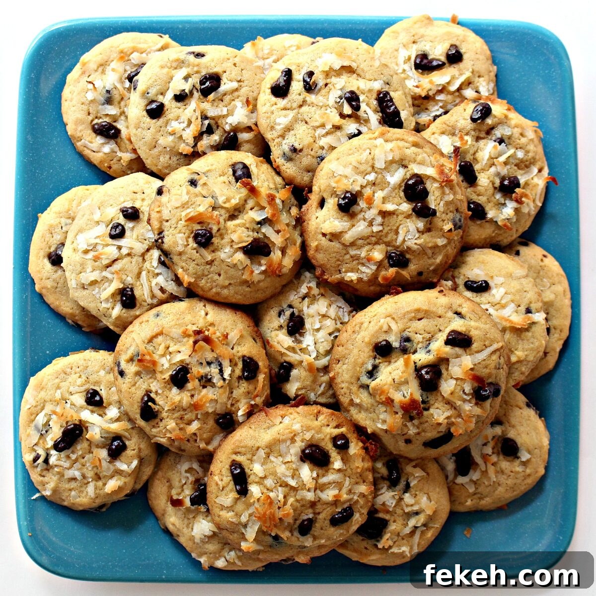 Coconut Milk Cookies make a lovely snack or party treat. Square, aqua serving plate with Coconut Milk Cookies.
