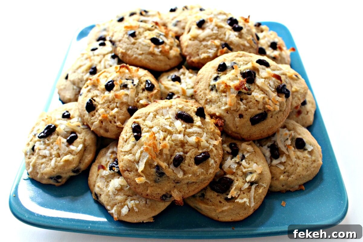 A platter piled with Coconut Milk Cookies. An aqua serving platter piled with cookies.
