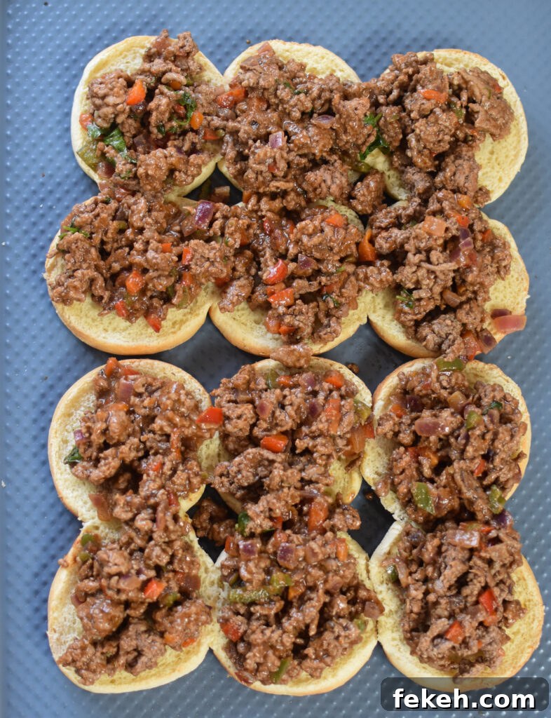 Taco Beef Sliders: Quick Party Sliders with Spicy Beef & Cheese 10 Taco Beef Sliders beef on buns.