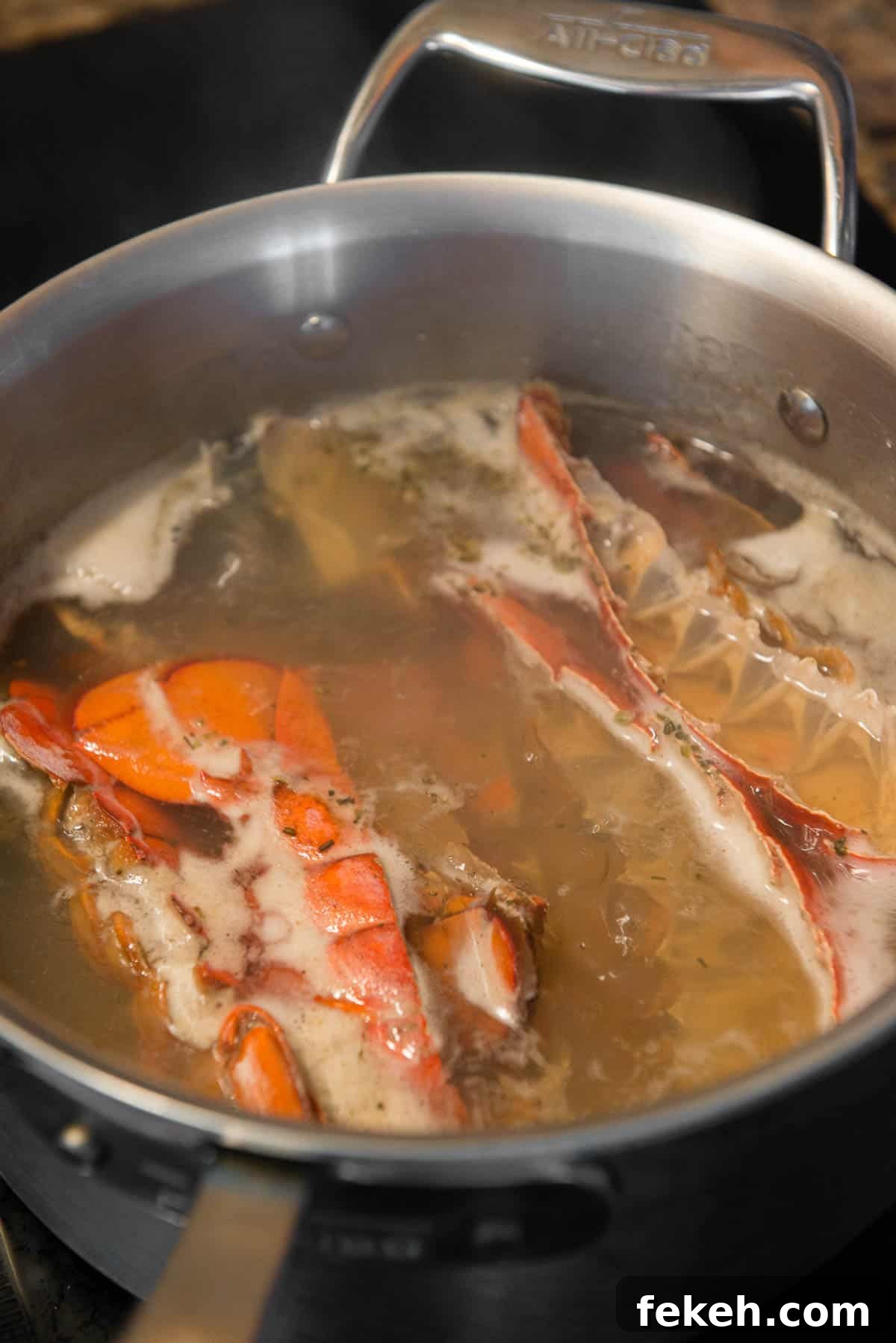 lobster tail shells simmering in water to make stock
