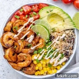 Spicy Lime Shrimp Burrito Bowl with Cilantro Rice 7 top view shrimp burrito with avocado, cauliflower rice, tomatoes, and corn